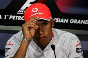 Lewis Hamilton apologises at a press conference in Malaysia